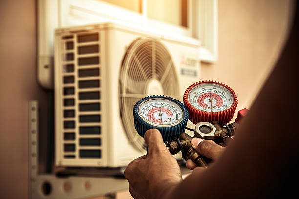 Professional Air Conditioning Service technician working in Nassau, DE